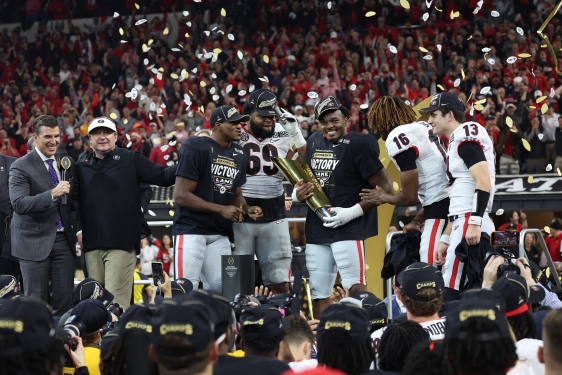 photo of stadium trophy ceremony, confetti, players
