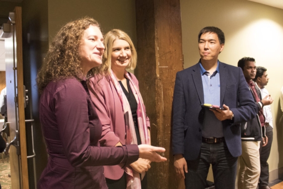 photo of several people speaking at an event